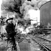 A fireman tackles the blaze at the Scottish Tar Distillers' plant at Camelon in November 1973. Pic: TSPL