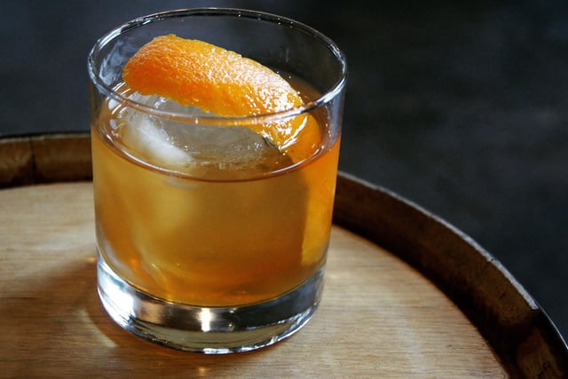 Taking minutes to make, to create an Old Fashioned simply mix 1 tsp of sugar, 2 dashes Angostura bitters, a splash of water and 60ml Scotch whisky or bourbon into a tumbler. Garnish with ice and an orange slice. Some also like the addition of a maraschino cherry and a dash of soda water.