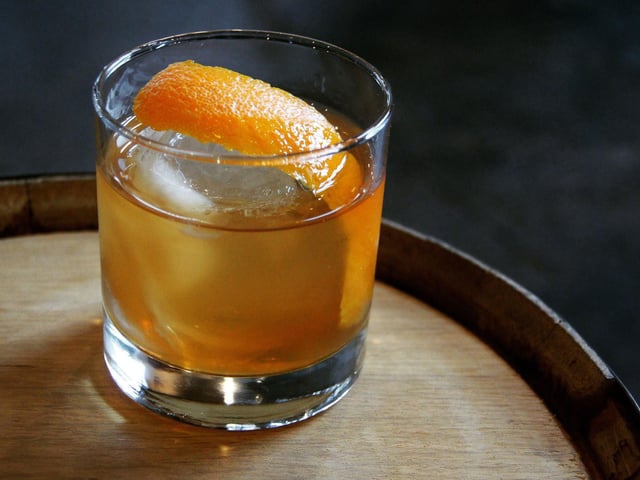 Taking minutes to make, to create an Old Fashioned simply mix 1 tsp of sugar, 2 dashes Angostura bitters, a splash of water and 60ml Scotch whisky or bourbon into a tumbler. Garnish with ice and an orange slice. Some also like the addition of a maraschino cherry and a dash of soda water.