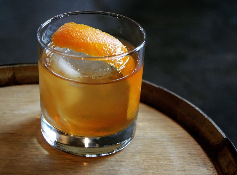 Taking minutes to make, to create an Old Fashioned simply mix 1 tsp of sugar, 2 dashes Angostura bitters, a splash of water and 60ml Scotch whisky or bourbon into a tumbler. Garnish with ice and an orange slice. Some also like the addition of a maraschino cherry and a dash of soda water.