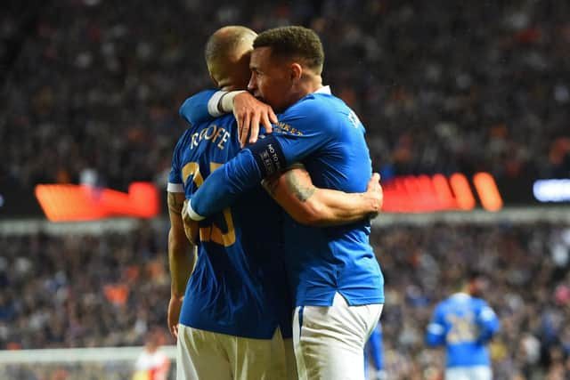 Rangers striker Kemar Roofe celebrates his winning goal with captain James Tavernier.