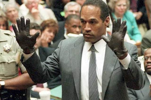 O.J. Simpson during his double murder trial in Los Angeles (Photo by VINCE BUCCI / POOL / AFP)