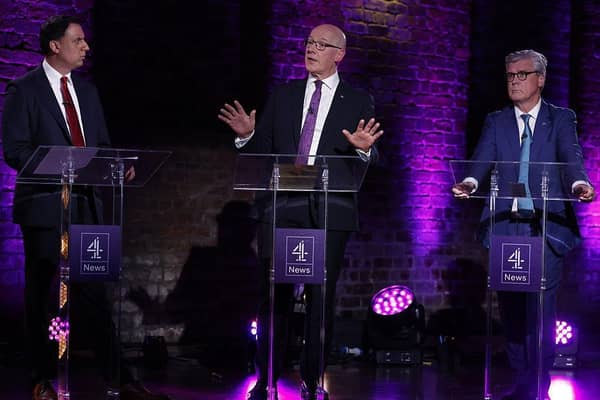 Labour's Anas Sarwar and Reform's Malcolm Offord flank SNP leader John Swinney at a Channel 4 New leaders' debate on 14 April (Picture: Jeff J Mitchell/Getty Images)