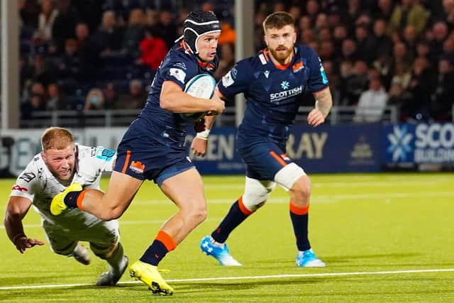 Edinburgh's Darcy Graham on his way to scoring a second-half try against Dragons.