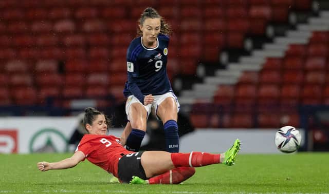 Scotland's Caroline Weir and Austria's Sarah Zadrazil during a FIFA Women's World Cup playoff match between Scotland and Austria at Hampden Park, on October 06, 2022, in Glasgow, Scotland. (Photo by Alan Harvey / SNS Group)