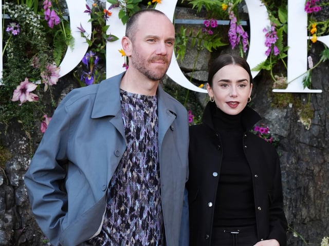 Charlie McDowell and Lily Collins attend the Dior Cruise 2025 show at Drummond Castle, Perthshire.