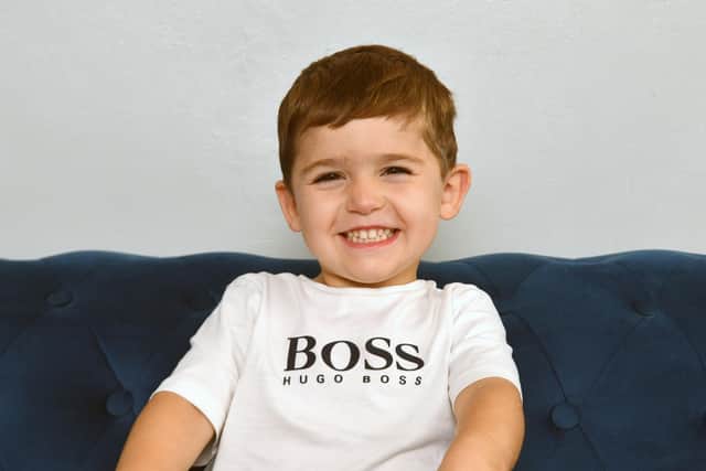 Rudi, four, is delighted to have raised so much money to "make boys and girls in hospital feel better". Pic: Michael Gillen