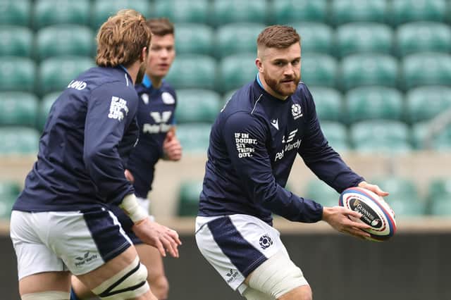 Luke Crosbie passes the ball during the Scotland captain's run at Twickenham. (Photo by David Rogers/Getty Images)