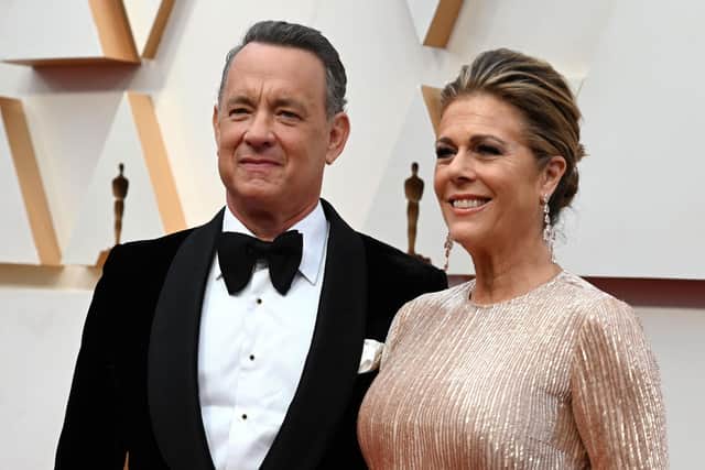 US actor Tom Hanks and wife Rita Wilson arrive for the 92nd Oscars at the Dolby Theatre in Hollywood, California on February 9, 2020. - March 11, 2020 Tom Hanks announces a positive test for coronavirus. (Photo by Robyn Beck / AFP)