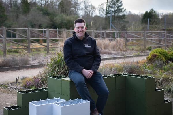 Andrew Vincent with the building blocks, which are made from recycled plastic. Picture: Andrew Loughlin, 360 Bid