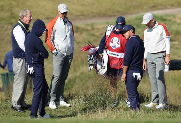 Brooks Koepka asks for a rules decision on the 15th hole during the Saturday morning foursomes in the 43rd Ryder Cup at Whistling Straits. Picture: Warren Little/Getty Images.