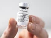 A nurse holds a bottle of Pfizer coronavirus vaccine at the NHS Louisa Jordan Hospital in Glasgow, as part of a mass vaccination drive by NHS Greater Glasgow and Clyde. Photo credit should read: Jane Barlow/PA Wire