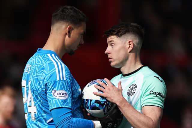 Aberdeen goalkeeper Kelle Roos had words with Hibs striker Kevin Nisbet before the penalty miss.