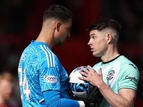 Aberdeen goalkeeper Kelle Roos had words with Hibs striker Kevin Nisbet before the penalty miss.