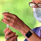 A health worker prepares to vaccinate members of the public on the South Side of Glasgow. Picture: Jeff J Mitchell/Getty Images