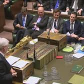 In 2015, the then Shadow chancellor John McDonnell offered a copy of Chairman Mao's Little Red Book (on table) to then Chancellor George Osborne (Picture: PA)