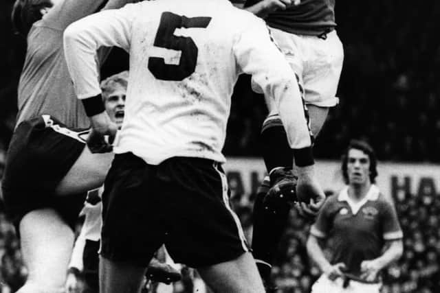 Gordon McQueen of Manchester United in action for his team during a match against Tottenham Hotspur at White Hart Lane. (Photo by Evening Standard/Getty Images)