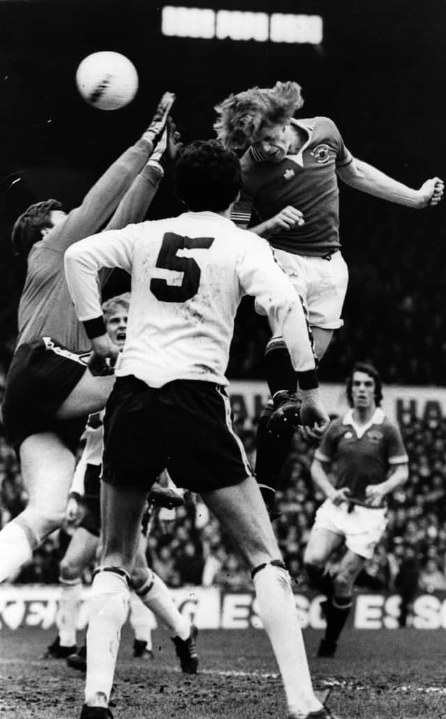 Gordon McQueen of Manchester United in action for his team during a match against Tottenham Hotspur at White Hart Lane. (Photo by Evening Standard/Getty Images)