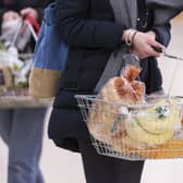 A woman holding a shopping basket, as the inflation rate has remained stubbornly high in the UK. Picture: Jon Super/PA Wire