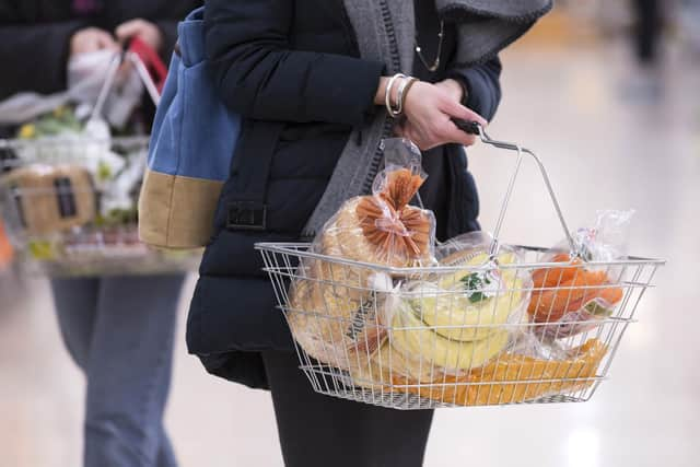 A woman holding a shopping basket, as the inflation rate has remained stubbornly high in the UK. Picture: Jon Super/PA Wire