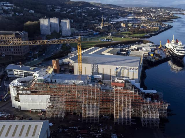 Glen Rosa clad in scaffolding with Glen Sannox moored behind, at the Ferguson Marine shipyard in Port Glasgow. Picture: Jane Barlow/PA Wire