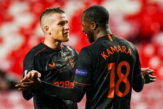 Steven Davis congratulates Glen Kamara after his goal in Lisbon  (Photo by Gualter Fatia / SNS Group)