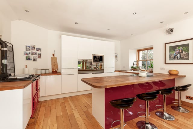 Interior: The cottage is entered via a 200-year-old door and the lounge is kept cosy by a log-burner. Its kitchen and family room has bi-folding doors opening to the garden and there are three bedrooms. Contact Savills