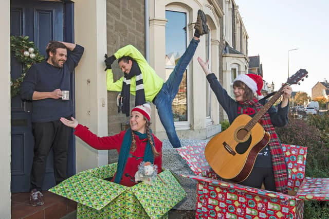 For their combined Christmas offering, PRESENT, Dundee Rep and Scottish Dance Theatre staged special, socially distanced private performances for some very deserving Dundonians. Here, actors Emily Winter and Leah Byrne from Dundee Rep Ensemble are joined by dancer Oscar Perez of Scottish Dance Theatre as they make a surprise appearance on a doorstep in Broughty Ferry. PIC: Neil Hanna
