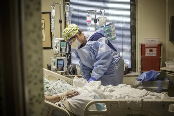 A registered nurse works with a Covid-19 positive patient. Picture: Dan Busey/The TimesDaily via AP