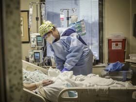 A registered nurse works with a Covid-19 positive patient. Picture: Dan Busey/The TimesDaily via AP