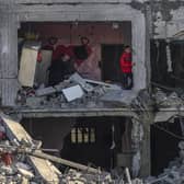 Palestinians inspect the damage in the rubble of a building where two hostages were reportedly held before being rescued during an operation by Israeli security forces in Rafah, on the southern Gaza Strip. Picture: Said Khatib/AFP via Getty Images