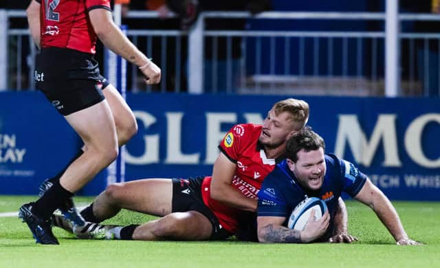 Edinburgh's Ewan Ashman scores a try on his debut during the win over Emirates Lions at the Hive Stadium. (Photo by Ross Parker / SNS Group)