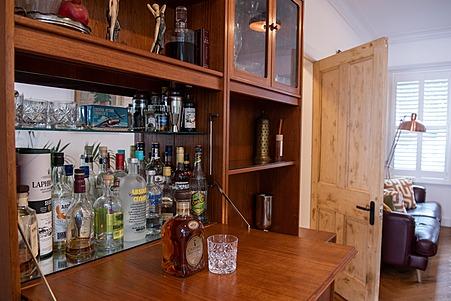 A home bar offers a range of choices to toast the homeowners' success in getting to the final.