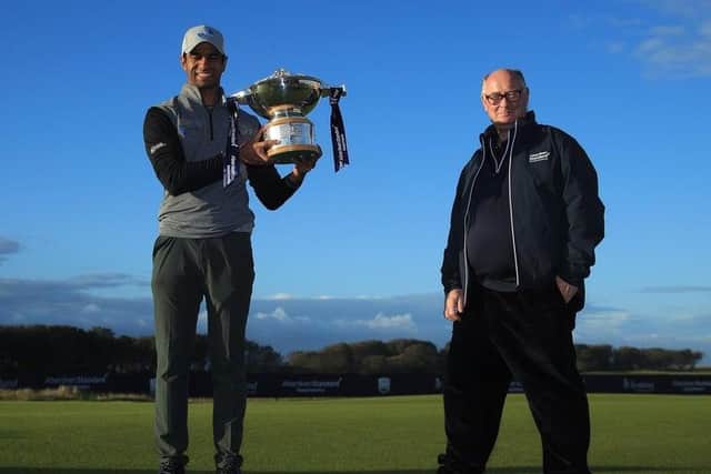 England's Aaron Rai, left, won the last staging of the Aberdeen Standard Investments Scottish Open under its current contract but Aberdeen Standard Life chairman Sir Douglas Flint, right, was hopeful a new deal could be struck for the Rolex Series event and that has indeed been the case. Picture: Andrew Redington/Getty Images