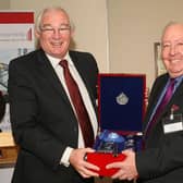 Bill Taylor (right) with his presentation from Provost Jim Leishman