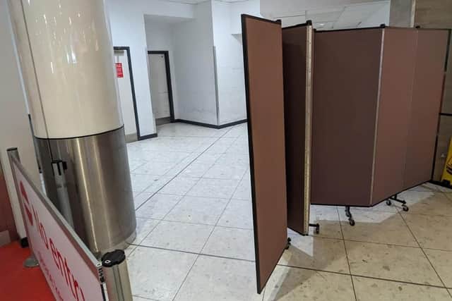 Disrupted passengers were directed to an unmarked door behind a screen at Edinburgh Airport for help with onward travel. (Photo by LDH for The Scotsman)
