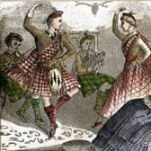 A tartan-clad couple dances to the sound of the bagpipes for Queen Victoria, in an engraving from around 1880 (Image: Fototeca Gilardi/Getty Images)