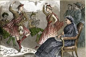 A tartan-clad couple dances to the sound of the bagpipes for Queen Victoria, in an engraving from around 1880 (Image: Fototeca Gilardi/Getty Images)