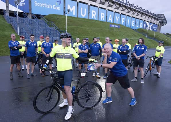 Scottish rugby legend Kenny Logan (on bike) and Ally McCoist (right) prior to setting off from Murrayfield Edinburgh with a team of celebrities on a 700 mile endurance challenge from Edinburgh to Paris to raise money for the charity set up by the late Doddie Weir. Photo: Mark F Gibson/PA Wire