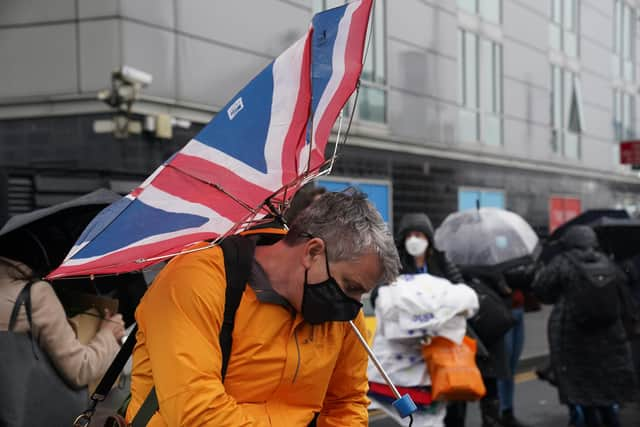 Welcome to Glasgow: Delegates try to cope with the  conditions as the wait to enter the Scottish Event Campus ahead of the Cop26 summit.