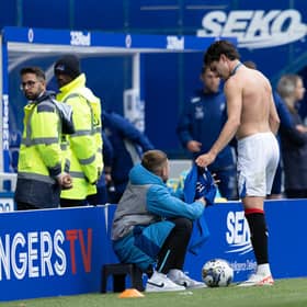 Ianis Hagi gives his shirt to a ballboy after Rangers' 2-1 win over Morton at Ibrox.