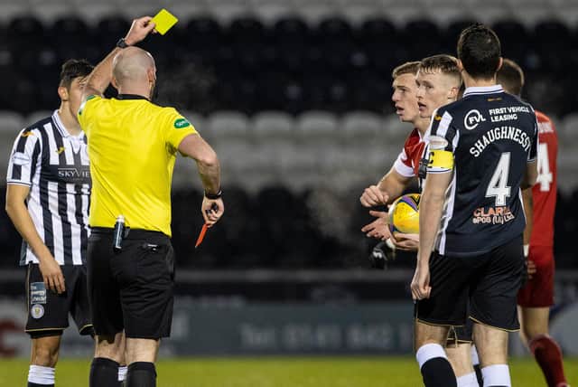 Aberdeen's Lewis Ferguson is shown a second yellow card.