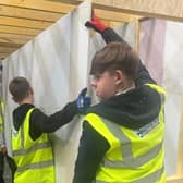 Senior pupils from Castlebrae Community Campus are helping with the construction of the test home at the Energy Training Academy in Dalkeith.