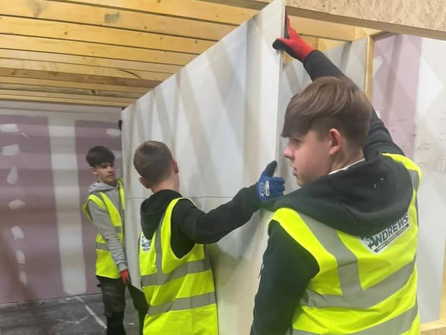 Senior pupils from Castlebrae Community Campus are helping with the construction of the test home at the Energy Training Academy in Dalkeith.