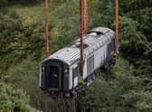 A carriage is lifted by a giant 600 tonne crane from the scene at the train derailment in September last year. (Photo by Derek Ironside - Pool/Getty Images)