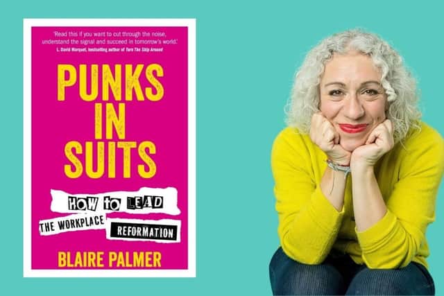 Author Blaire Palmer besides her new book "Punks in Suits".