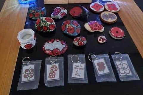 A collection of some of the items that Max sold to raise money for Poppy Scotland, including 'poppy rocks'.