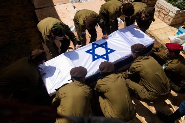 Soldiers carry the coffin of Dor Yarhi, who was killed in a battle with Palestinian militants near the Israeli border with the Gaza Strip.