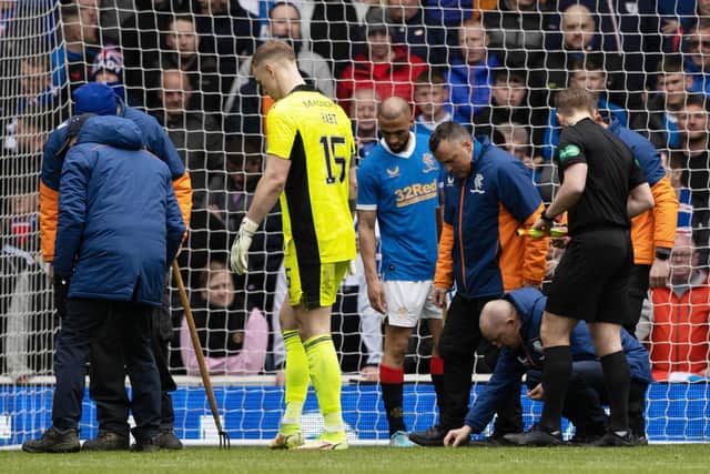 The start of the second half is delayed as broken glass is removed from Joe Hart's goal during a cinch Premiership match between Rangers and Celtic at Ibrox Stadium, on April 02, 2022, in Glasgow, Scotland.  (Photo by Craig Williamson / SNS Group)