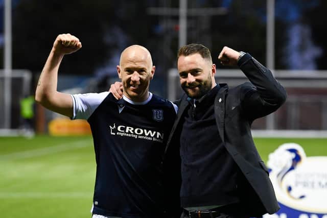Dundee's Charlie Adam and manager James McPake celebrate at full time at Rugby Park.